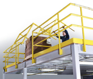 Worker operating pivoting mezzanine gate